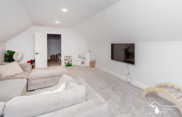 living room with lofted ceiling and carpet