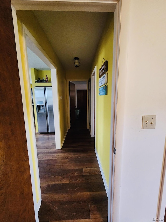 hallway with dark wood-type flooring