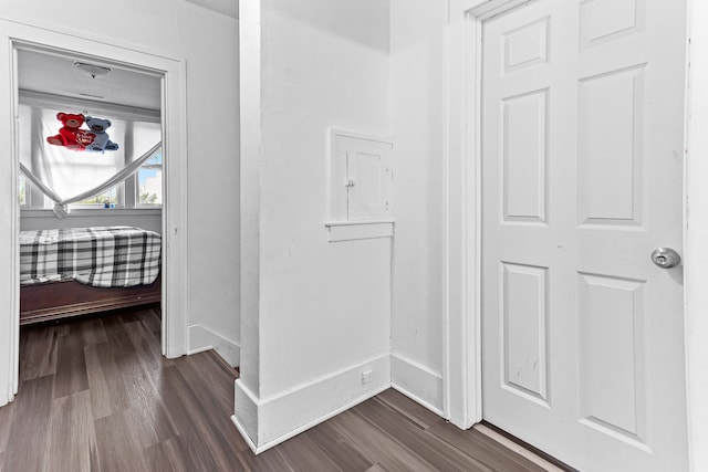 hallway with dark wood-type flooring