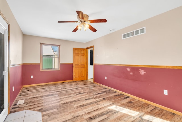 unfurnished room with light hardwood / wood-style floors and ceiling fan