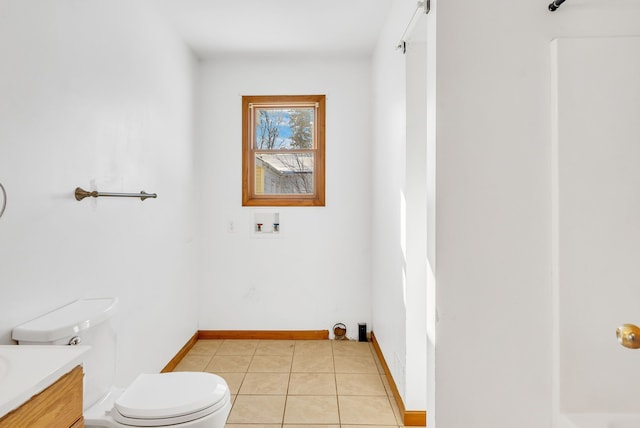 bathroom featuring vanity, toilet, and tile patterned flooring