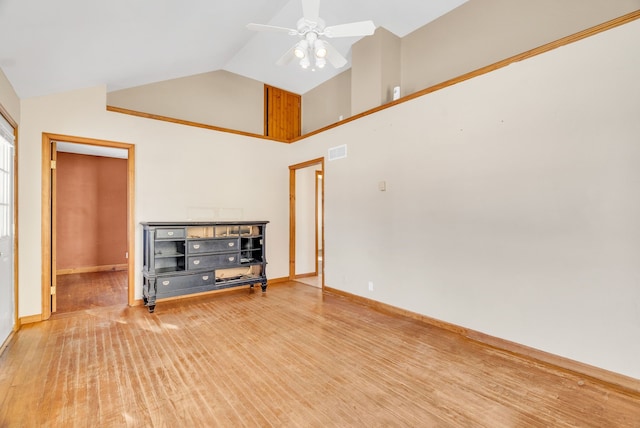 unfurnished living room with hardwood / wood-style flooring, high vaulted ceiling, and ceiling fan