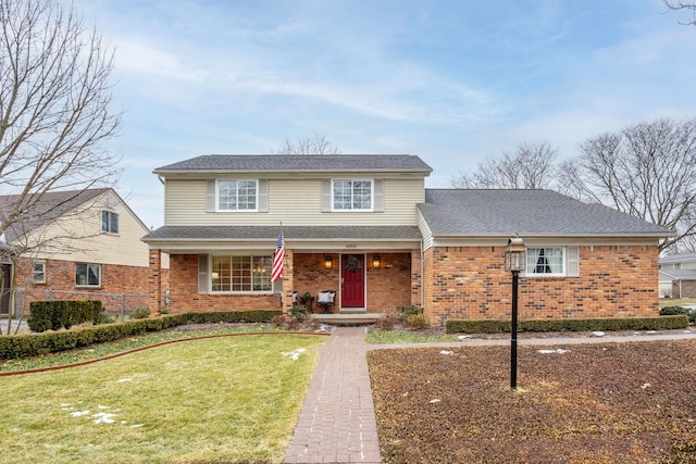 front of property featuring covered porch and a front lawn