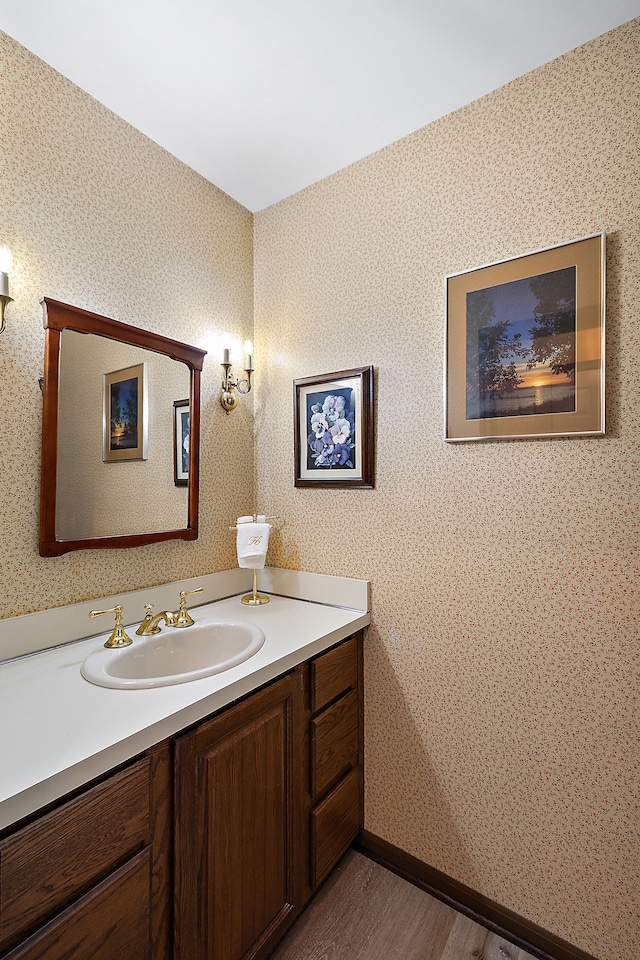 bathroom featuring vanity and hardwood / wood-style floors