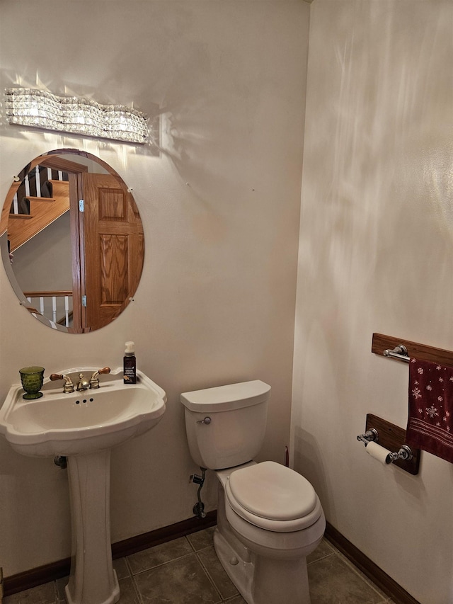 bathroom with tile patterned flooring and toilet