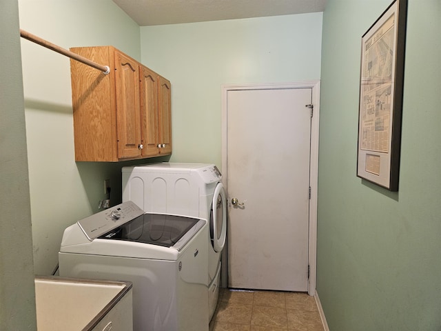 laundry room with cabinets, separate washer and dryer, and sink