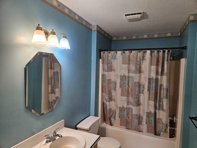 full bathroom with vanity, toilet, a textured ceiling, and shower / bath combo