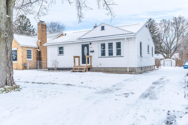 view of front of house with a storage unit