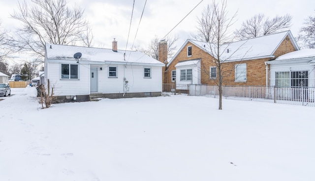 view of snow covered house