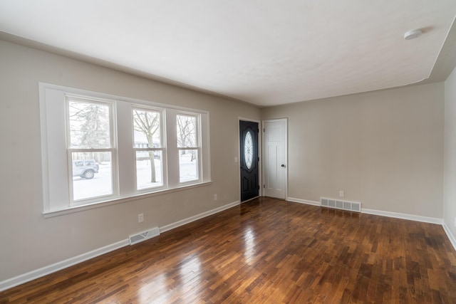 unfurnished room featuring dark hardwood / wood-style floors