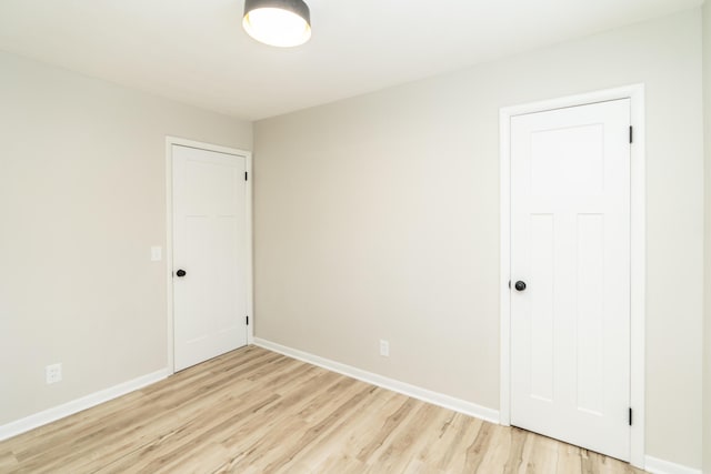 unfurnished room featuring light wood-type flooring