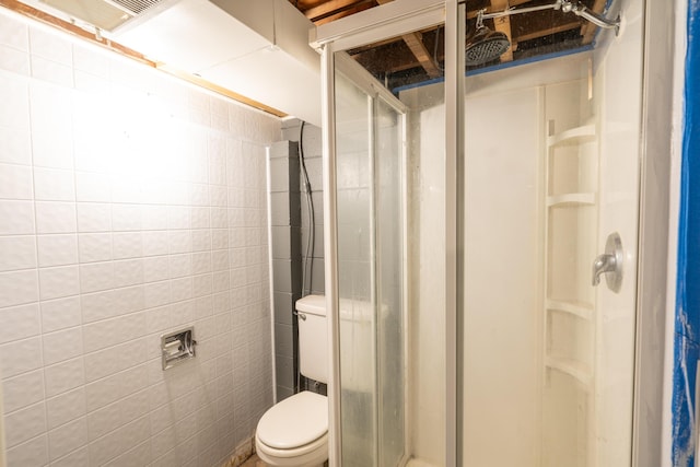 bathroom with toilet and walk in shower