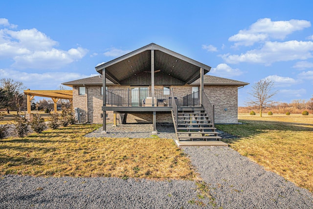 view of front of home featuring a deck and a front yard