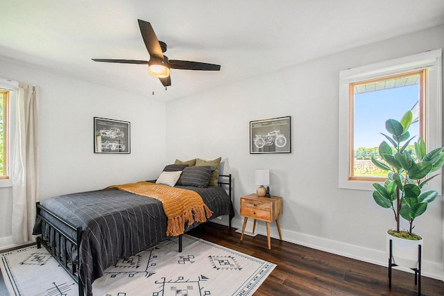 bedroom featuring dark wood-type flooring and ceiling fan