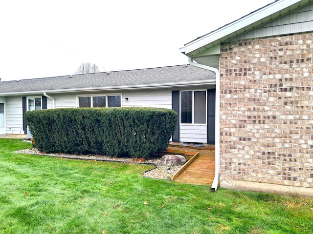 view of property exterior featuring a lawn