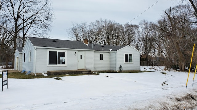 view of snow covered house