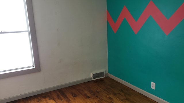 empty room featuring dark hardwood / wood-style floors