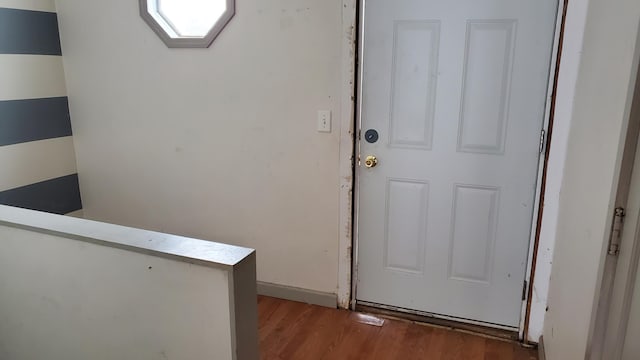 doorway with wood-type flooring