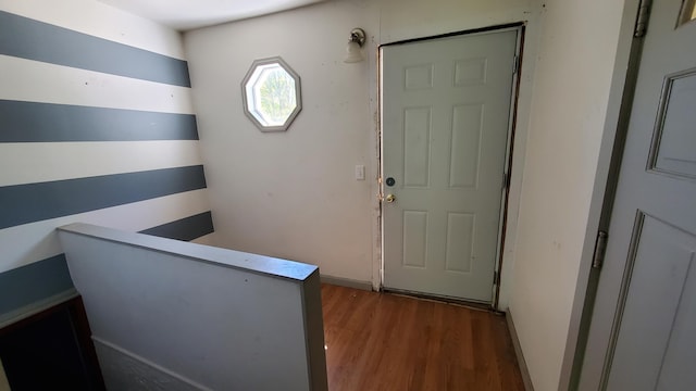 930 W Barney Ave, Muskegon, MI 49441 - doorway featuring wood finished floors and baseboards
