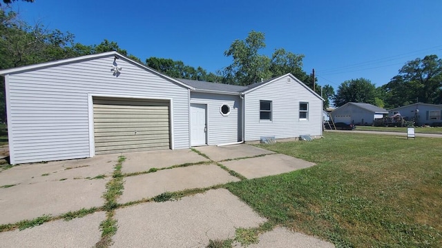 930 W Barney Ave, Muskegon, MI 49441 - ranch-style house featuring a front lawn, concrete driveway, and a garage