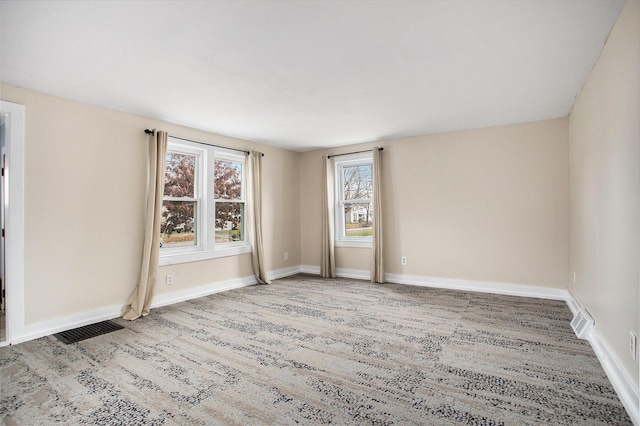 spare room featuring hardwood / wood-style flooring