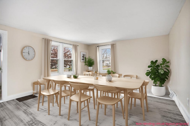 dining area featuring wood-type flooring