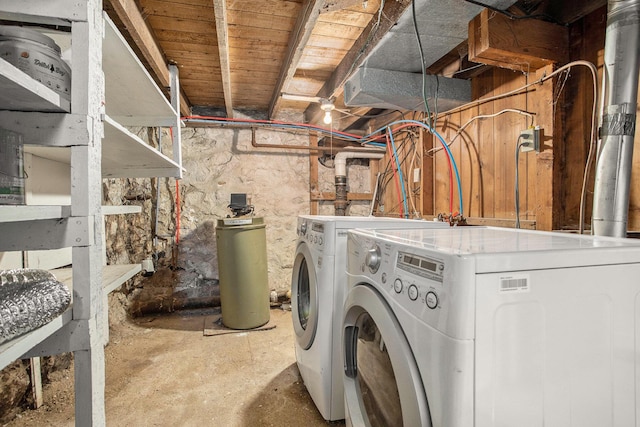 clothes washing area with washer and clothes dryer