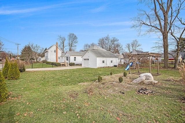 view of yard with a pergola and a playground