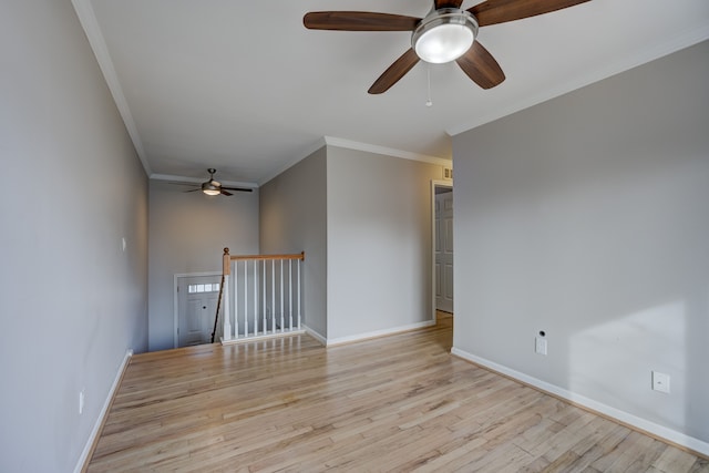 unfurnished room featuring ornamental molding and light hardwood / wood-style floors