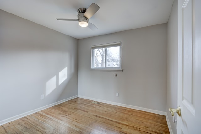 unfurnished room with ceiling fan and light wood-type flooring