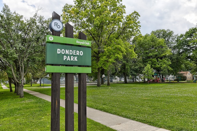 surrounding community featuring a playground and a yard