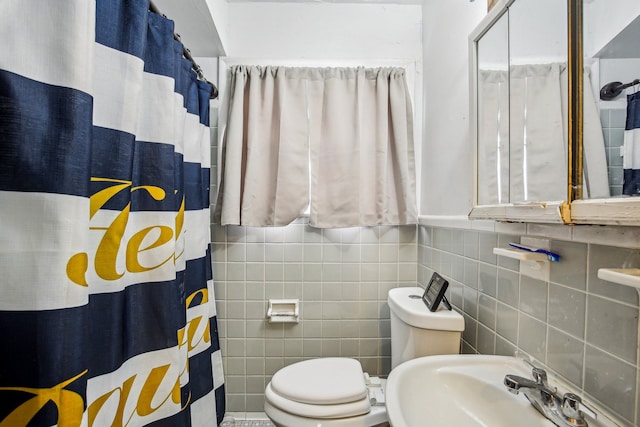 bathroom featuring walk in shower, toilet, and sink