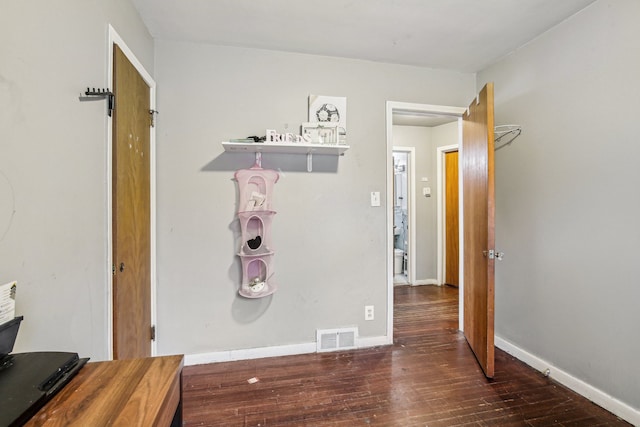 hallway featuring dark wood-type flooring