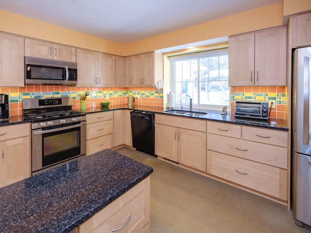 kitchen featuring stainless steel appliances, sink, and light brown cabinets