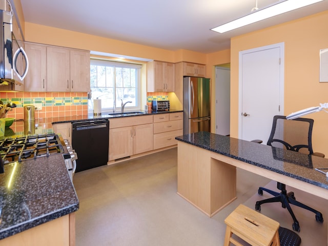 kitchen with light brown cabinetry, sink, and stainless steel appliances