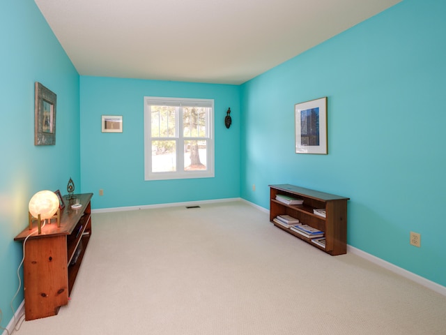 sitting room featuring carpet floors