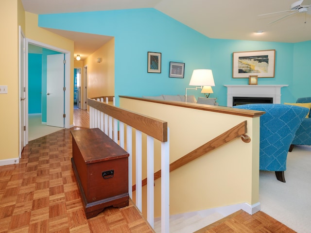 corridor with lofted ceiling and parquet floors