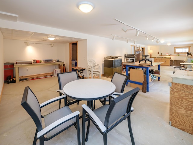 dining room featuring rail lighting