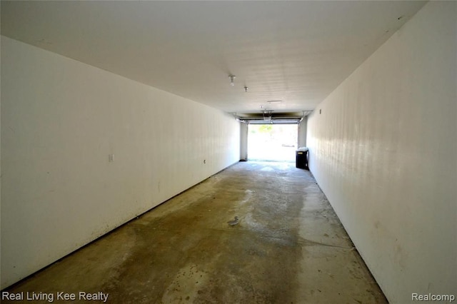 hallway featuring concrete flooring