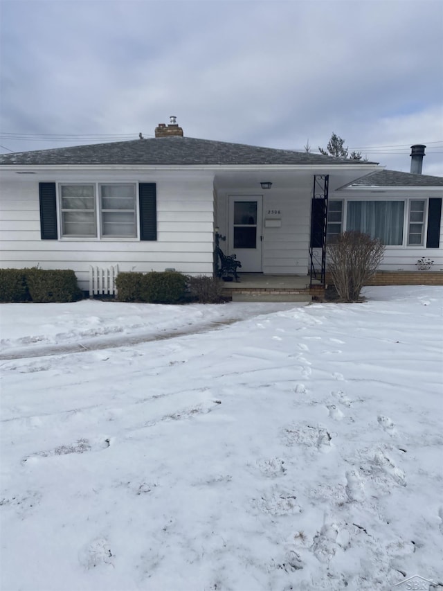 single story home featuring covered porch