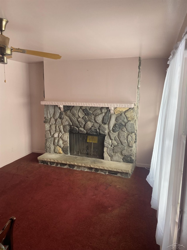 interior details featuring a fireplace and carpet flooring