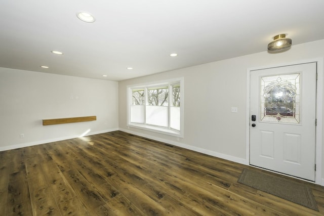 foyer with dark hardwood / wood-style floors