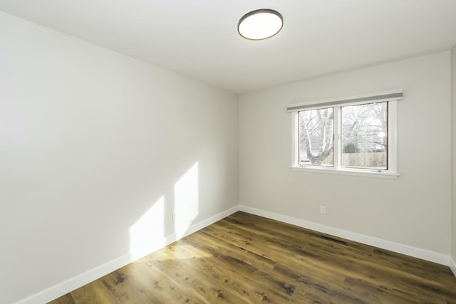 empty room featuring dark hardwood / wood-style floors