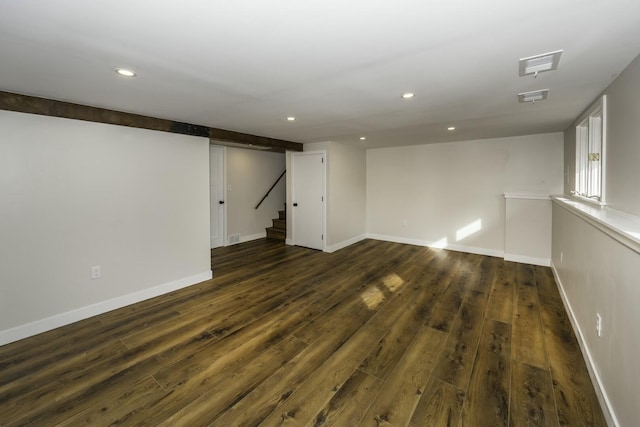 basement featuring dark hardwood / wood-style floors