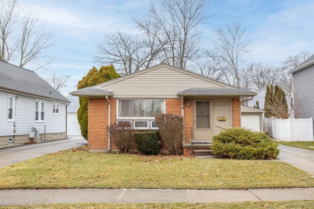 bungalow-style house with a front yard