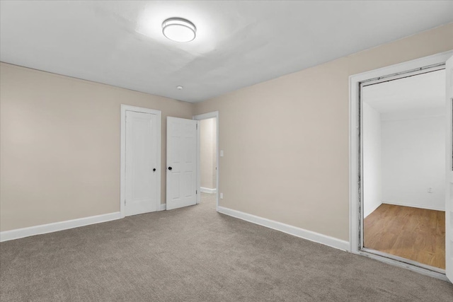 unfurnished bedroom with carpet floors and a closet