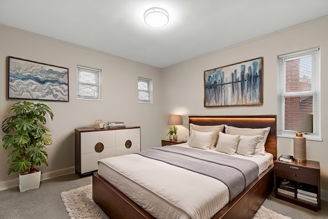 carpeted bedroom featuring multiple windows