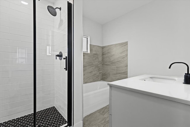 bathroom featuring vanity and shower with separate bathtub