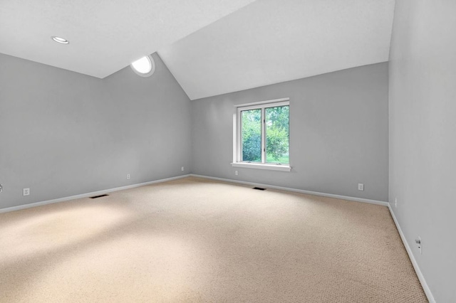 interior space with carpet and lofted ceiling