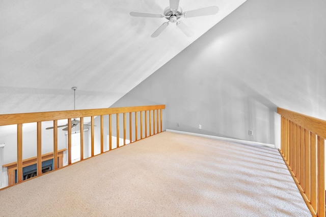 additional living space featuring light carpet, vaulted ceiling, and ceiling fan